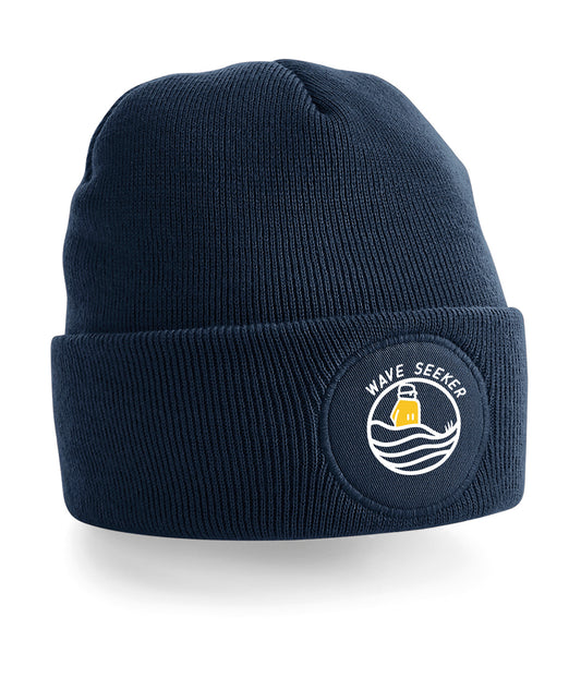 Beanie with a Logo of a surfer in the dunes waiting for the perfect wave 